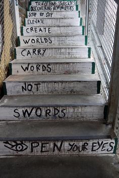 some stairs with graffiti written on them