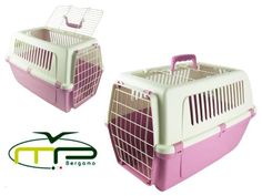 two pink and white pet carriers sitting next to each other