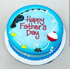 a blue birthday cake with the words happy father's day on it