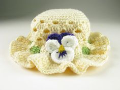 a crocheted hat with flowers on it