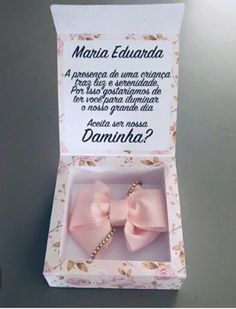 two pink bows are in a box on a table with the caption do you know what this bow is?