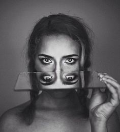 a woman's face with black and white makeup is shown in this instagramture