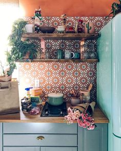 a kitchen counter with pots and pans on it