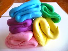 there are five different colored donuts stacked on top of each other in the shape of spirals