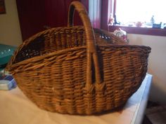 a wicker basket sitting on top of a table