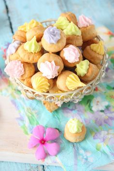 a basket filled with small cookies on top of a table