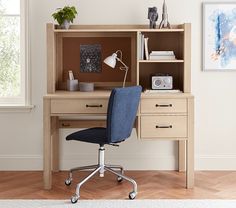 a desk with a blue chair in front of it