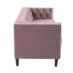 a pink couch with buttons on the back