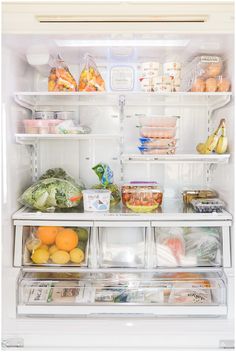 an open refrigerator filled with lots of different types of vegetables and fruit in it's doors