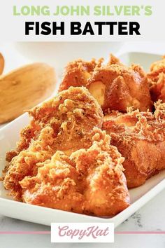 a white plate topped with fried fish batter