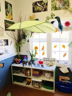 a child's playroom with toys and books