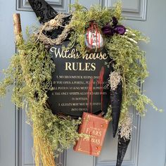 a witch's house rules wreath on the front door