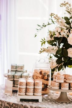 a table topped with lots of cakes and candles