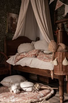 a bed with pillows and blankets on top of it in a room filled with furniture