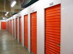 the inside of a storage unit with orange doors