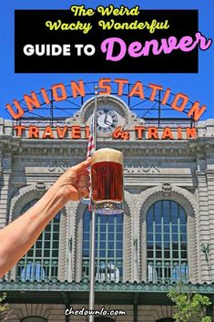 a person holding up a beer in front of a train station with the words guide to denver on it