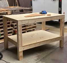 a workbench made out of wooden pallets