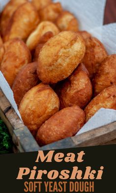 a box filled with fried doughnuts next to broccoli