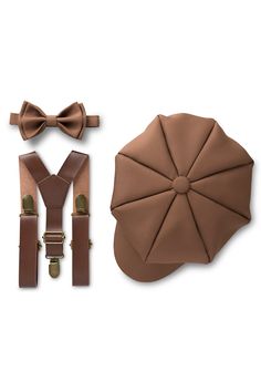 This 3 piece set of medium bow tie, newsboy hat and brown PU leather suspenders makes a great ring bearer or pageboy outfit. Wear it with dress pants, khakis or shorts for a dapper look! Dress up your little one for family photos or just because! MEDIUM BROWN BOW TIE Pre-tied which makes it very easy to wear. It will keep a perfect shape throughout the event and won't look droopy. Made out of matte no shiny poplin fabric. Baby size is made with a velcro closure on the strap for ease of use. Todd Pageboy Outfits, Ring Bearer Suit, Brown Ring, Brown Bow Tie, Brown Rings, Leather Suspenders, Newsboy Hat, Wedding Centerpieces Diy, News Boy Hat