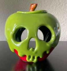 an apple shaped like a skull on a table