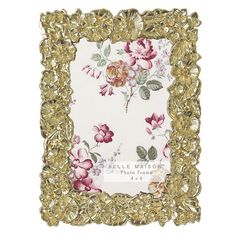 a gold frame with pink flowers on it