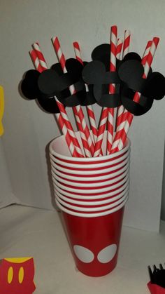 mickey mouse paper straws in a red cup