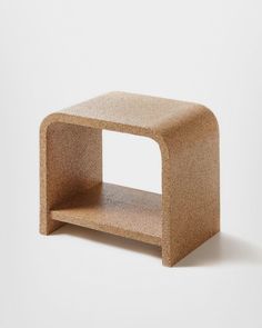 a small table made out of cork on a white background