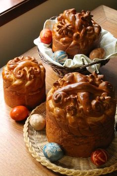 three bundt cakes sitting on top of a wooden table