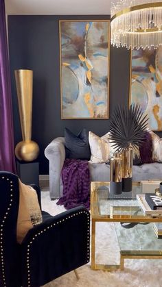 a living room filled with furniture and a chandelier