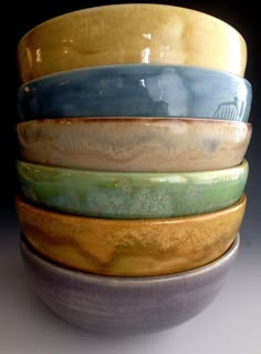 a stack of ceramic bowls sitting on top of each other