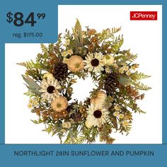 a wreath with flowers and pine cones on it for $ 84 99 reg $ 75 00