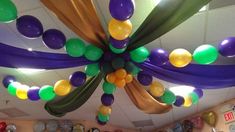 the ceiling is decorated with balloons and streamers