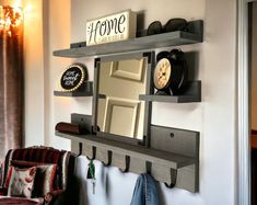 "Add a farmhouse rustic feel to your entryway with our entry coat rack & wall shelves. Optional Mirror measures 12\" x 12\". With a large top shelf and 2 small shelves on both sides of the mirror to display your favorite small plant, photos, or small farmhouse decor. Has 6 large hooks to hang your keys & coats. Can also be used in a mudroom, kitchen or laundry room. Made with solid wood. Wood stain available in English Chestnut, Espresso, True Black, Weathered Gray, Dark Bourbon or White Wash. C Entryway Mirror And Shelf, Mirror And Coat Hooks, Small Farmhouse Decor, Entryway Floating Shelves, Modern Coat Rack Wall, Farmhouse Entrance, Entryway Wall Shelf, Entry Coat Rack, Mudroom Kitchen