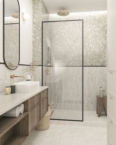 a bathroom with two sinks and a large mirror on the wall next to the shower