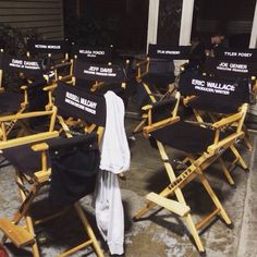 there are many chairs that have been set up in front of each other with the same name on them