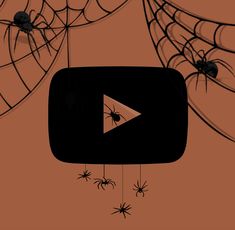 an orange background with black and white spider webs hanging from it's sides