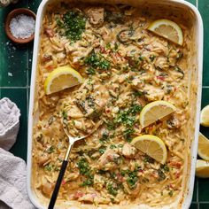 a casserole dish filled with pasta and lemons