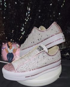 White low top Platform Converse with bling toe and back and a beautiful bling and pearl shoe. All Converse shoes are 100% authentic from Converse or authorized retail sellers. Shoes are not returnable once they are customized. So please make sure you order the correct size. * Shoes can be made with different color crystals and different size if requested. * Allow 3 to 4 weeks for shoes to be shipped after purchase date. (Processing time depends on work load, contact seller for a specific ship da Converse For Quinceanera, Quince Converse, Platform Low Top Converse, Bedazzled Converse, Converse Ideas, Rhinestone Converse, Quinceanera Shoes, Pearl Shoe, Bling Converse