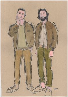 two men standing next to each other in front of a brown paper background with the same drawing on it