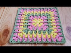 a crocheted dishcloth on a wooden surface