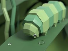 a 3d rendering of a caterpillar sitting on a green surface