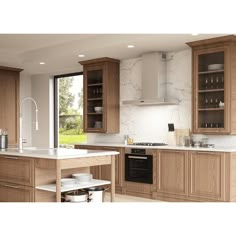 a kitchen with wooden cabinets and marble counter tops