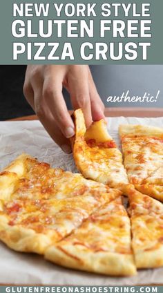 someone is cutting into a pizza with cheese on it and the text overlay reads, new york style gluten free pizza crust