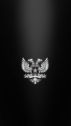 an eagle emblem on the side of a black leather background with white trimmings