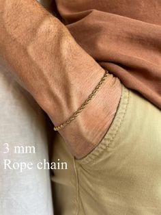 Elevate your style with our men's gold-tone stainless steel chain bracelet. Crafted from durable stainless steel, this bracelet is resistant to corrosion and tarnish, ensuring long-lasting shine and reliability. Features: - Material: Stainless Steel - Color: Gold-Tone - Sizes: Available in various lengths for a perfect fit You can see our other bracelet designs here https://www.etsy.com/shop/TheUrbanMonarch?ref=l2-about-shopname&from_page=listing§ion_id=49985390 This bracelet is perfect for both everyday wear and special occasions, easily pairing with other accessories and jewelry. The secure clasp ensures comfort and safety. Add a touch of elegance and modern flair to your wardrobe with this versatile chain bracelet! How to Choose the Right Size for a Chain Bracelet Measure Your Wrist: Wr Mens Chain Bracelet, Mens Gold, Chains For Men, Stainless Steel Jewelry, Steel Chain, Stainless Steel Chain, Chain Link Bracelet, Bracelet Designs, Link Bracelets