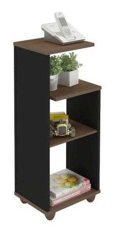 an entertainment center with two shelves and a remote control on top of the shelf next to it