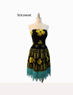 "Solo Mia Designs, my Panama-inspired collection, features imported fabrics.  Some are fabrics used in the everyday clothing of the women of the Guna Tribe of San Blas, Panama.  Items may also include molas, the textile art created by the Gunas.   This strapless dress has a bodice made from black and yellow saburete fabric (used as a wrap skirt by Guna Indian women) and is lined in black satin, with boning for support. The fabric for the skirt is the same as the bodice and it features hand-dyed venice lace in turquoise. The fullness of the skirt is gathered onto the bodice. Measurements: Bust-35.5\" Waist-29.5\" Width at hem-34.5\"( circumference- 69\") Length, waist to hem-17.5\" www.solomiadesigns.com" Black Bohemian Strapless Dress, Black Strapless Bohemian Dress, Everyday Clothing, San Blas, Black And Yellow, Dress Clothes For Women, Wrap Skirt, Houston Tx, Black Satin