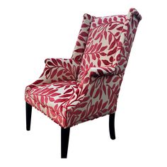 a red and white chair sitting on top of a wooden leg rest with a leaf print upholstered back