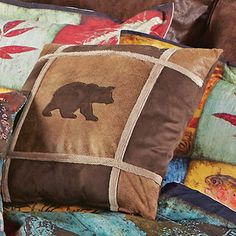 a brown bear pillow sitting on top of a couch