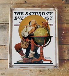 the saturday evening post sign is hanging on a wooden wall